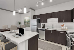 Large kitchen with stainless steel appliances and center island at Camden Asbury Village in Raleigh, NC