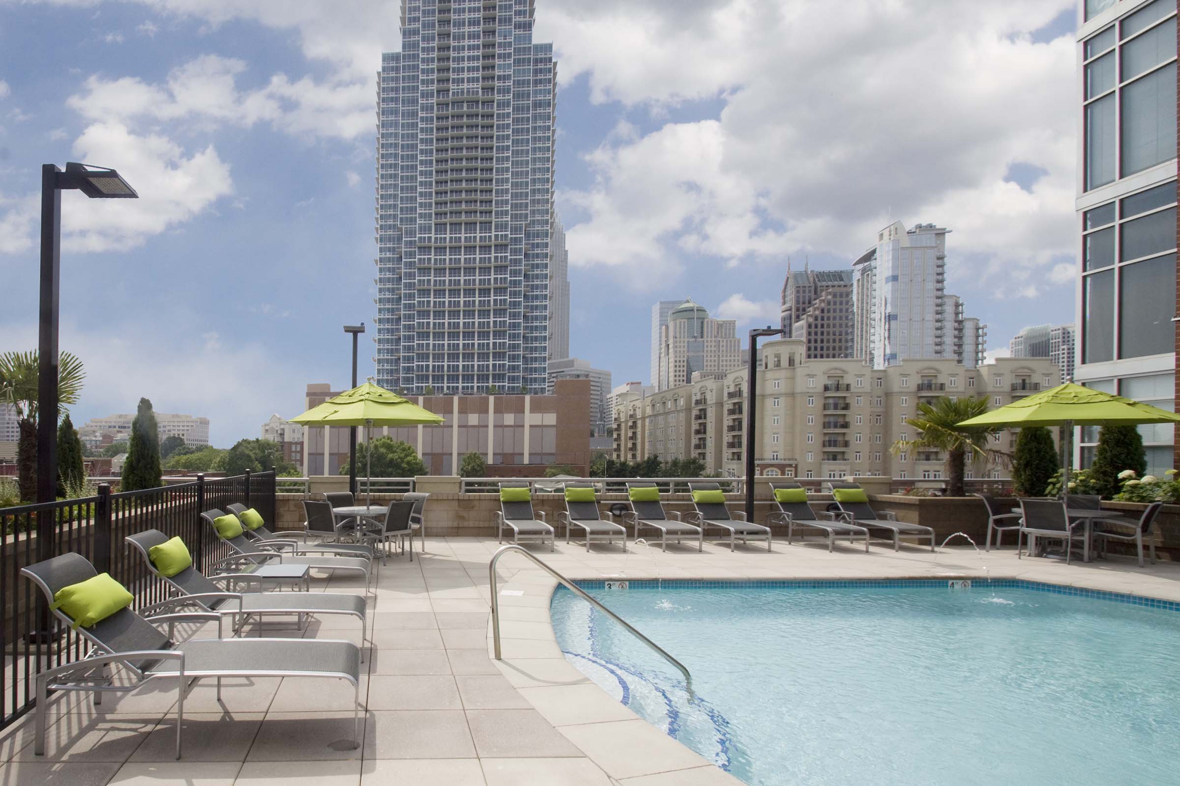 Rooftop pool with sundeck overlooking uptown charlotte