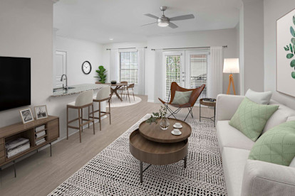 Townhome living room with wood-style floors at Camden Farmers Market in Dallas, Tx