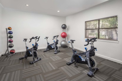 Spin room with spin bikes, weighted balls and yoga balls at Camden Stoneleigh