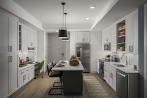 Kitchen with island and built-in desk at Camden Gilbert apartment homes in Gilbert, AZ