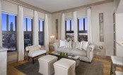 Living room with views of downtown hardwood flooring and crown molding