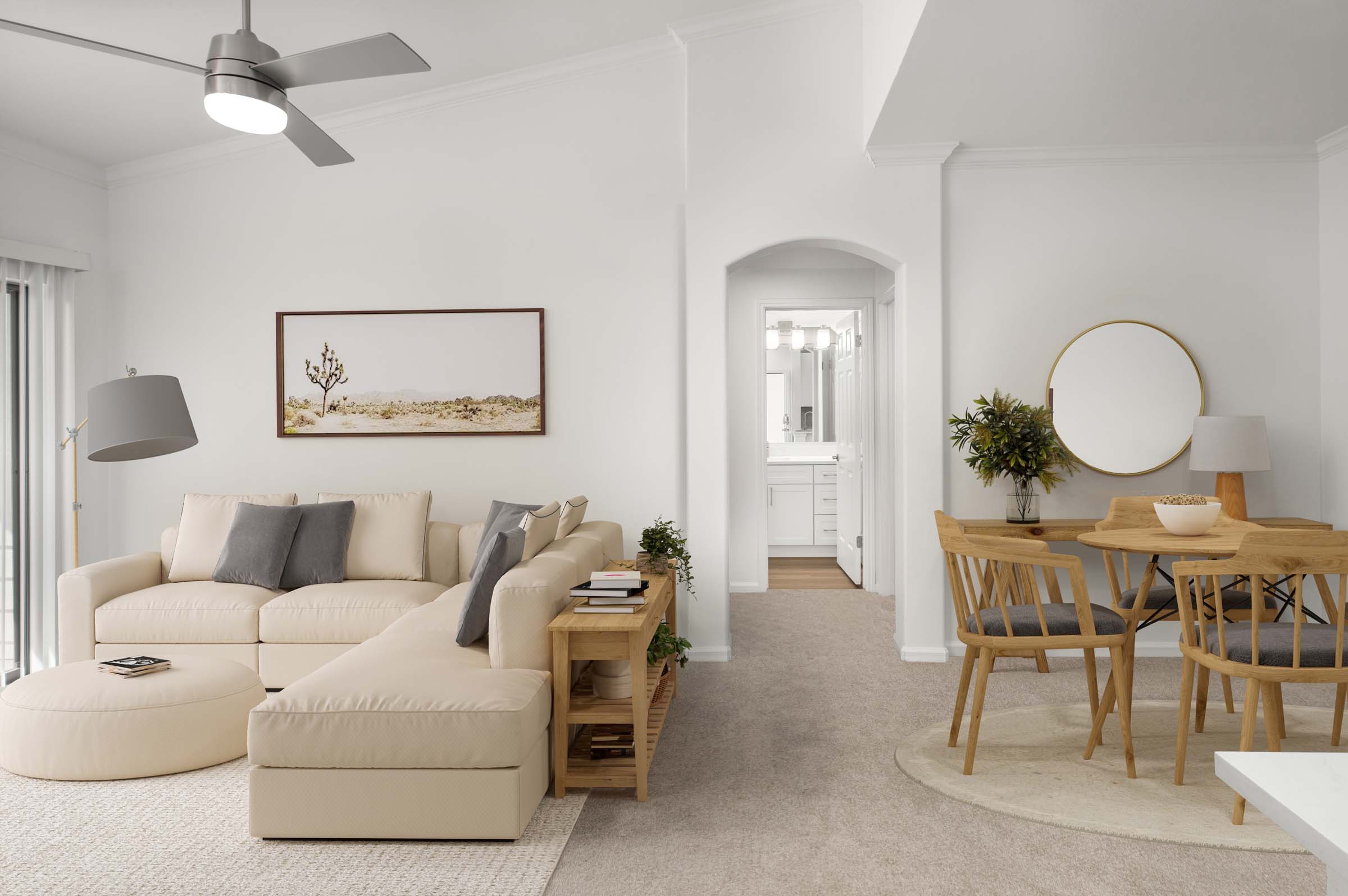 Living room and dining room with extended ceilings and plush carpet at Camden Stoneleigh apartments in Austin, TX.