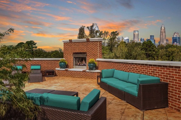Rooftop terrace with fireplace overlooking uptown Charlotte