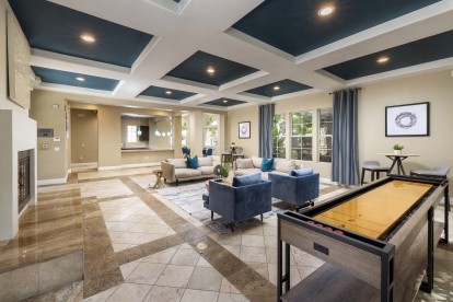 Camden Crown Valley Apartments Mission Viejo CA Clubhouse with Shuffleboard and Seating Areas