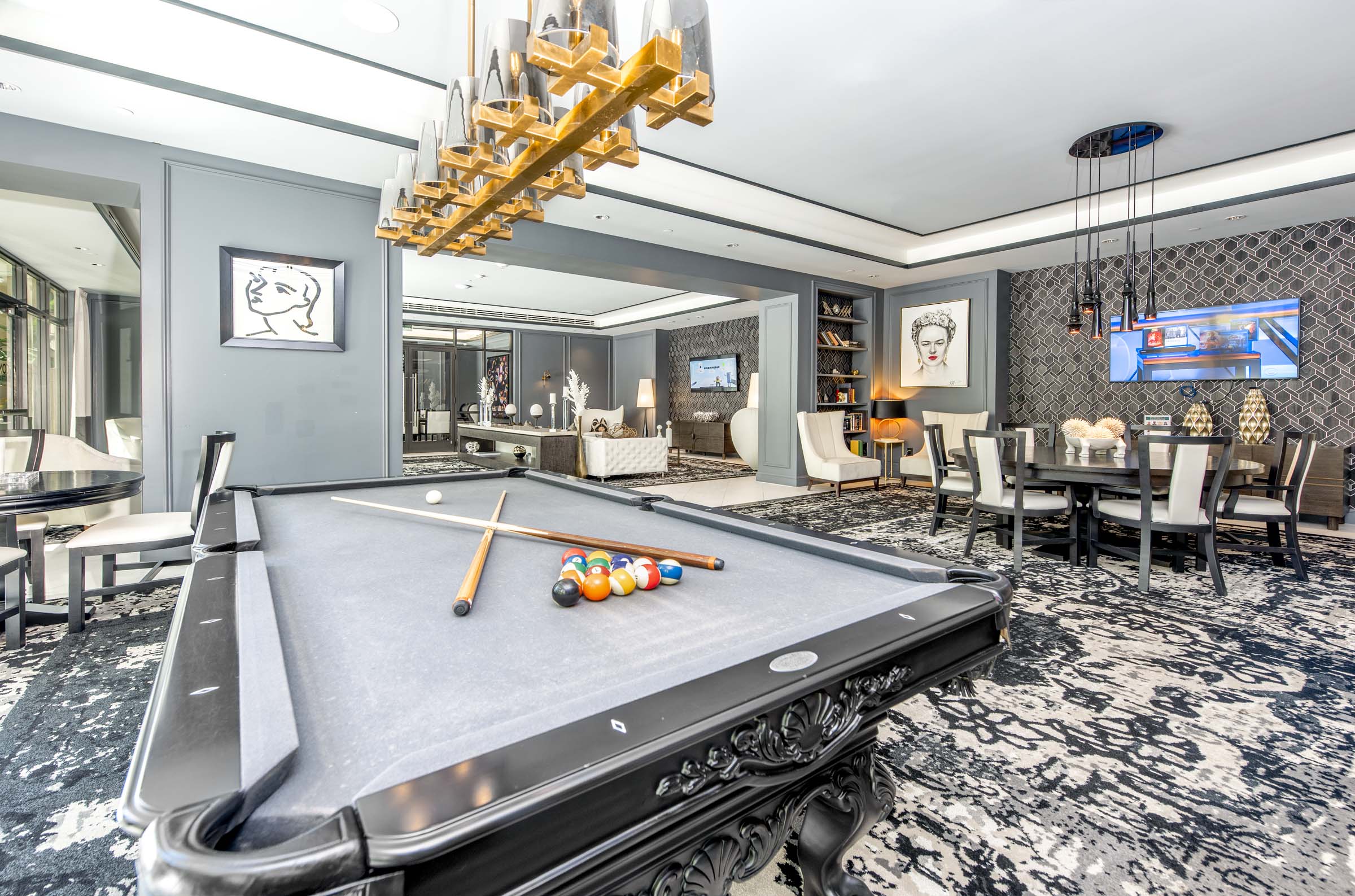 Join a game of pool at the billiards table in our Resident Lounge at Camden Central Apartments in St. Petersburg, FL.