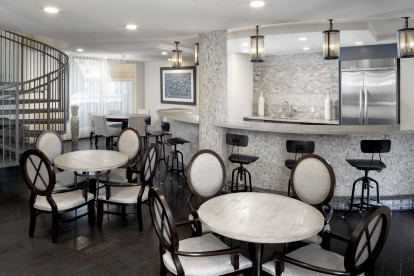 Resident lounge with dining and bar area.
