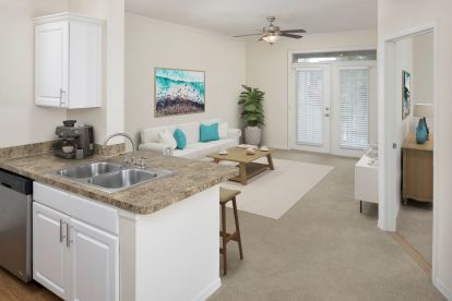 Open kitchen and living area with French doors to your balcony.