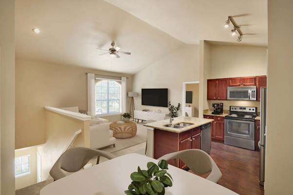 Top-floor townhome style apartment with vaulted ceilings and private stair entry at Camden Brushy Creek apartments in Cedar Park, TX
