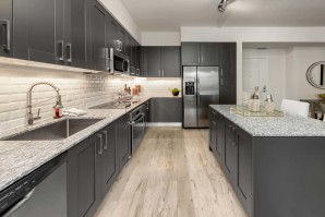 Gorgeous kitchen with Italian cabinetry, under cabinet LED lighting, and slow-close drawers. Stainless steel appliances including a microwave and pull down kitchen faucet, all make up this gourmet kitchen.