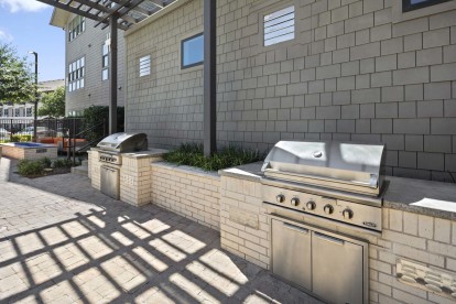 Poolside grills at the Villas pool at Camden Greenville apartments in Dallas, TX