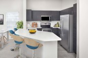 Kitchen with stainless steel appliances at Camden Lee Vista apartments in Orlando, FL