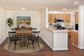 Upgraded lighting in dining and adjacent kitchen at Camden Touchstone in Charlotte, NC