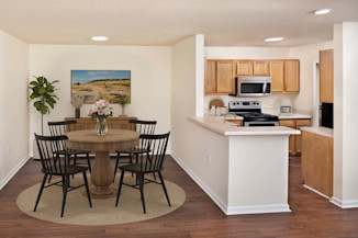 Upgraded lighting in dining and adjacent kitchen at Camden Touchstone in Charlotte, NC