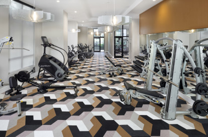 24-hour athletic club with strength training equipment at Camden Atlantic apartments in Plantation, Florida.