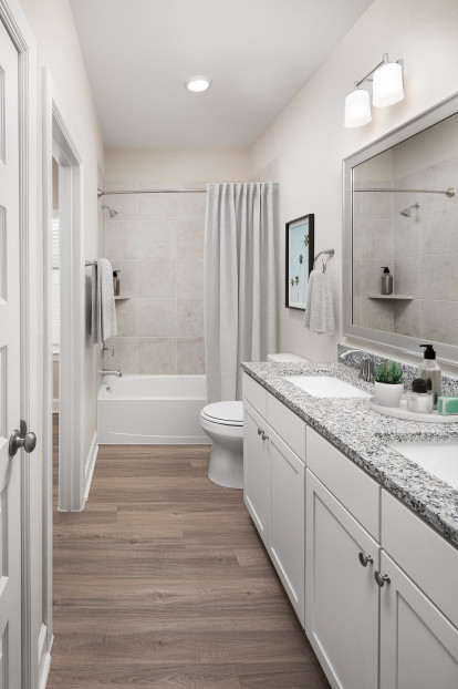 Bathrooms with double sink vanities and large bathtubs at Camden Long Meadow Farms homes for rent in Richmond, TX
