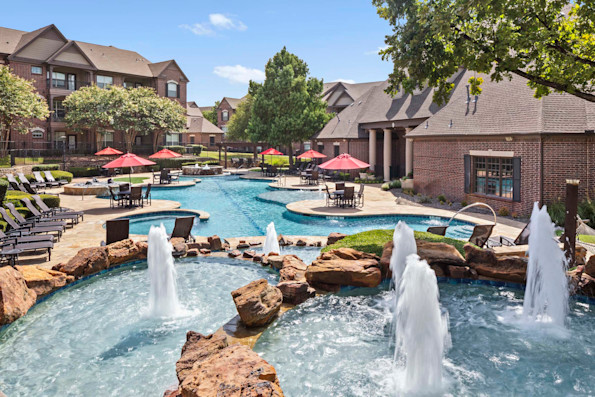 Resort-style pool with fountains at Camden Panther Creek in Frisco, TX