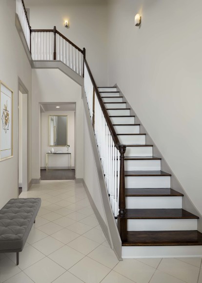 Townhome entry way with staircase to second level and tile flooring