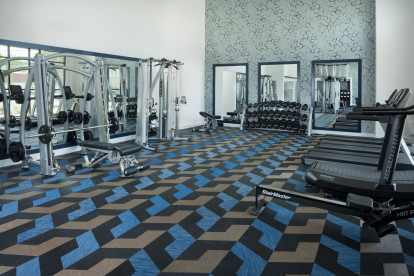 Camden NoDa apartments in Charlotte Athletic Club with free weights and cardio machines