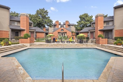 Front pool and sundeck with the fitness center behind at Camden Valley Park