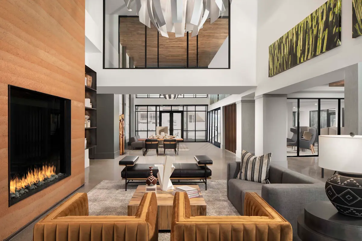 Double-height lounge with fireplace at Camden North End.