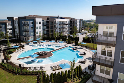 Aerial view of resort-style pool next to buildings at Camden West Nashville apartments in Nashville, TN