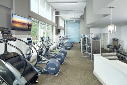 24-hour Fitness center with treadmills, stairclimber, ellipticals and strength machines.
