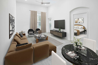 Open-concept living with wood-style flooring throughout on first-floor apartment homes at Camden Dulles Station in Herndon, VA