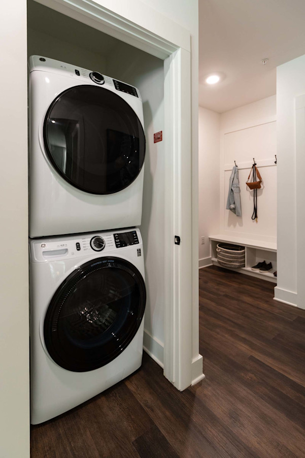 Stackable washer and dryer near mudroom entry at Camden West Nashville apartments in Nashville, TN