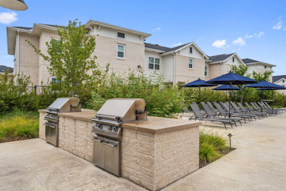 Poolside grills at Camden Leander apartments in Leander, Tx