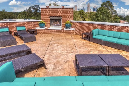 Private rooftop terrace with plenty of lounge seating and fireplace