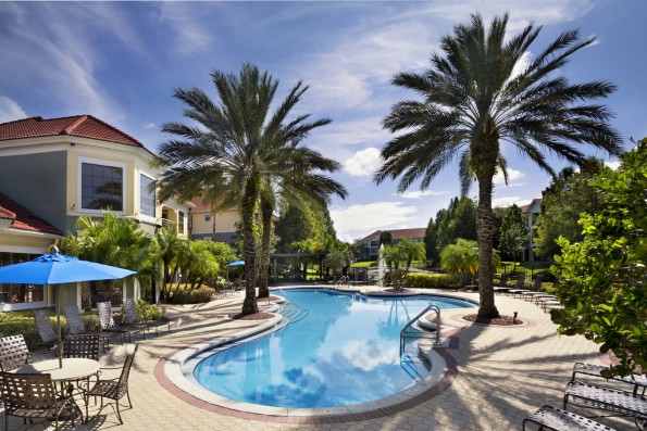 Pool with sun deck and outdoor seating