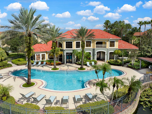Pool with sun deck and outdoor seating