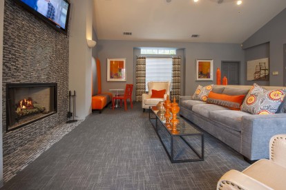 Social entertaining area with wifi and fireplace at Camden Stonebridge Apartments in Houston, TX
