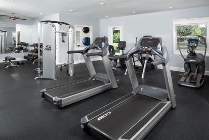 Fitness center with free weights circuit training cardio equipment and yoga studio