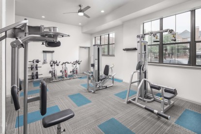 24-hour fitness center strength machines at Camden Farmers Market apartments in Dallas, TX