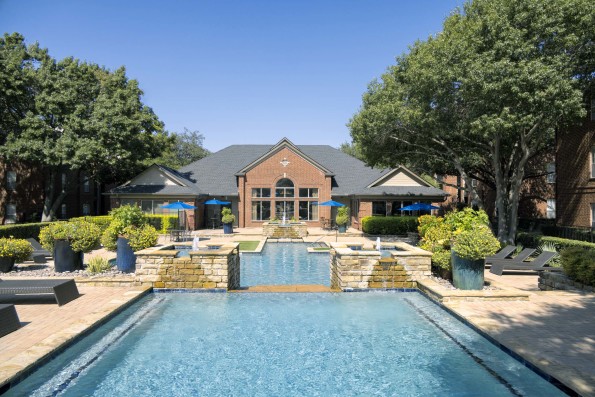 Resort-style pool top level with fountains at Camden Addison apartments in Addison, TX