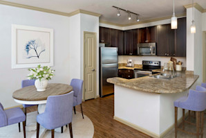 Dining room and kitchen with pantry and energy efficient stainless appliances
