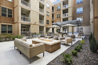Courtyard with fire pit at Camden Lincoln Station Apartments in Lone Tree, CO