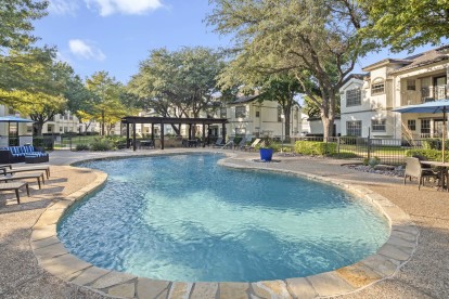 Second pool and sundeck with grilling area and poolside seating at Camden Legacy Creek