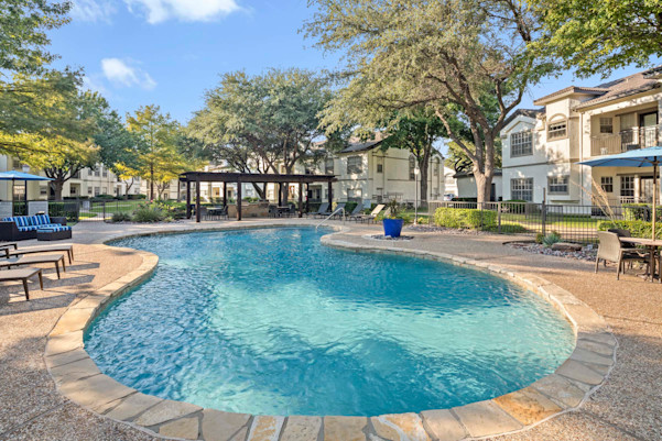 Second pool and sundeck with grilling area and poolside seating at Camden Legacy Creek