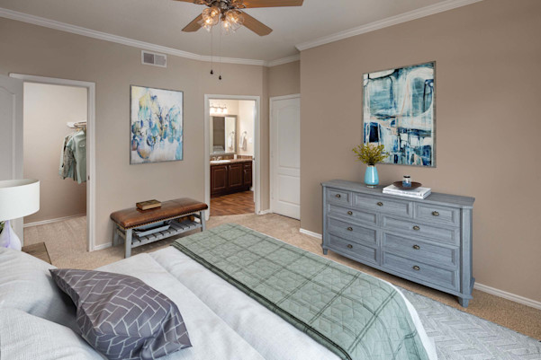 Bedroom with attached closet and bathroom