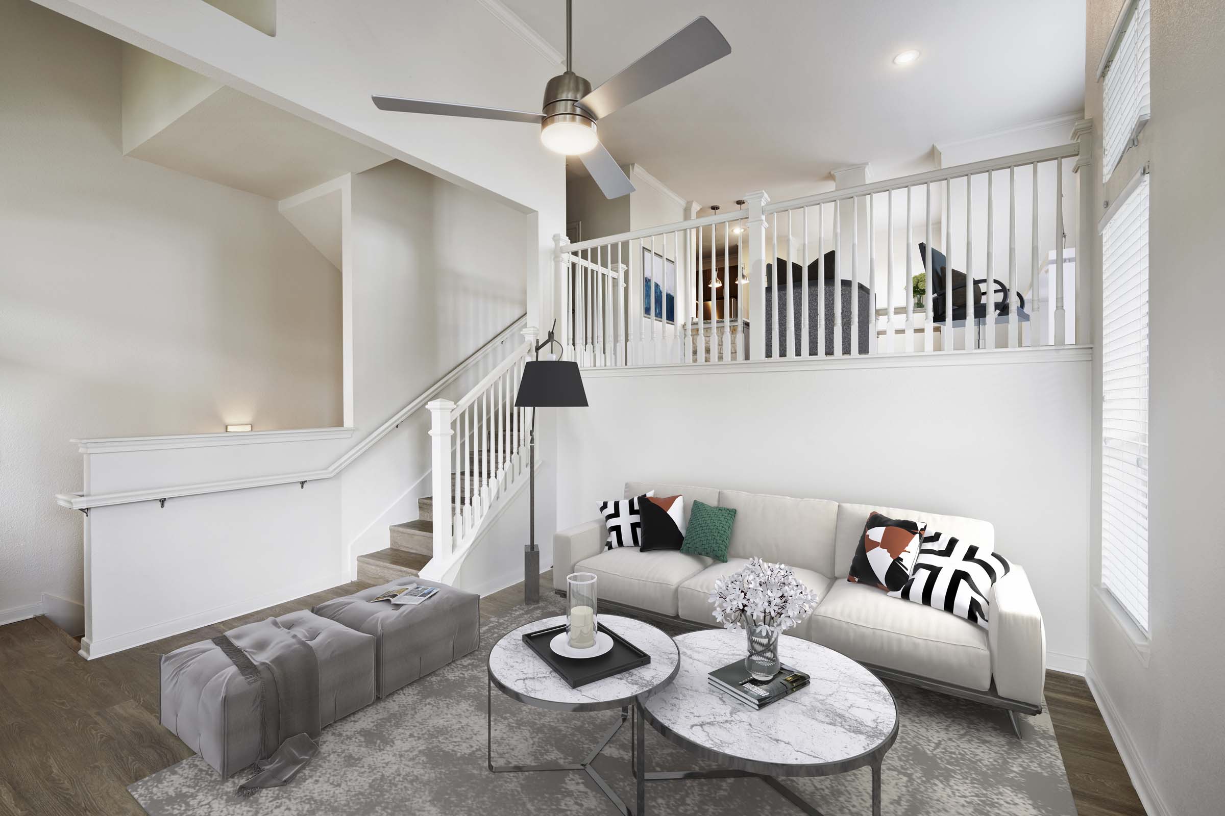 Multi level townhome living room with ceiling fan and high ceilings