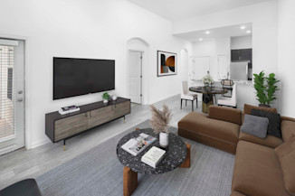 Open-concept living area with high ceilings at Camden Dulles Station apartments in Herndon, VA