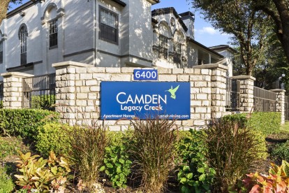 Entry sign in front of a building at Camden Legacy Creek