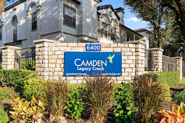 Entry sign in front of a building at Camden Legacy Creek