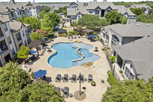 Aerial view of resort-style pool and sundeck at Camden Amber Oaks apartments in Austin, TX