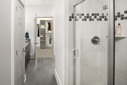 Bathroom with Walk-In Shower and Large Walk-In Closet