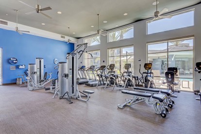 24-hour fitness center with strength training equipment and cardio machines