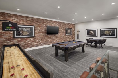 Resident lounge with shuffleboard billiards and poker table